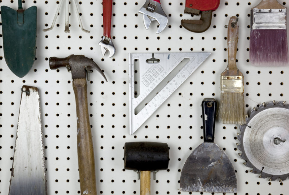 Tools organized on a garage pegboard